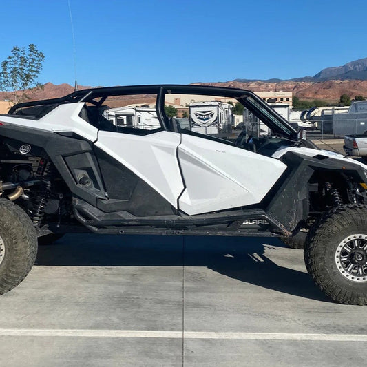 voodoo polaris pro xp rollcage installed on white and black 4 seat pro xp