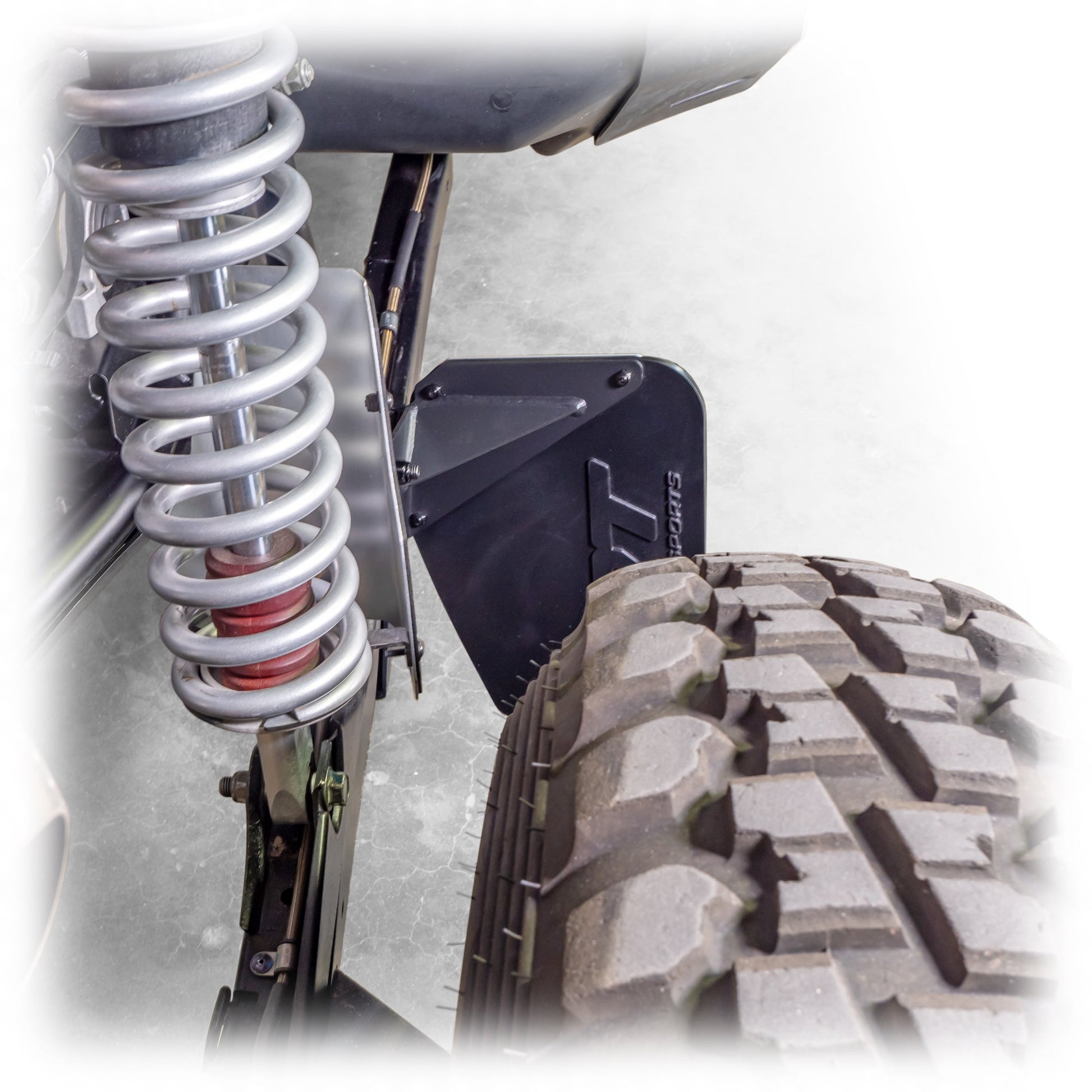 Polaris RZR Pro XP billet aluminum rock guard installed view rear suspension