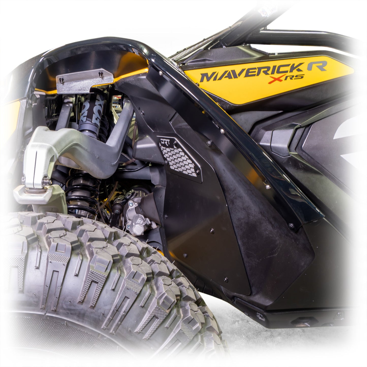 Close-up of a front aluminum rock guard installed on a Maverick R.