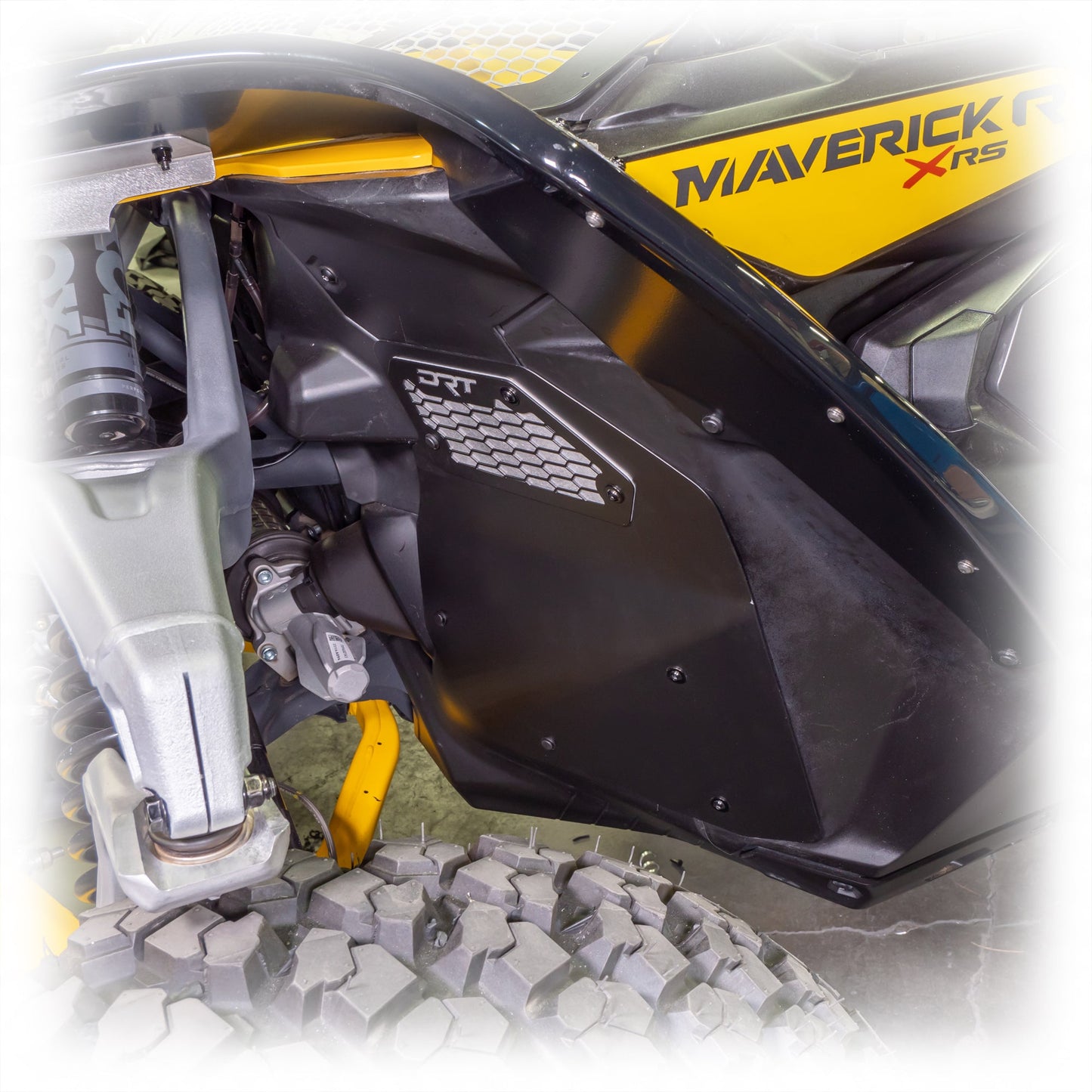 Close-up of a front aluminum rock guard installed on a Maverick R.
