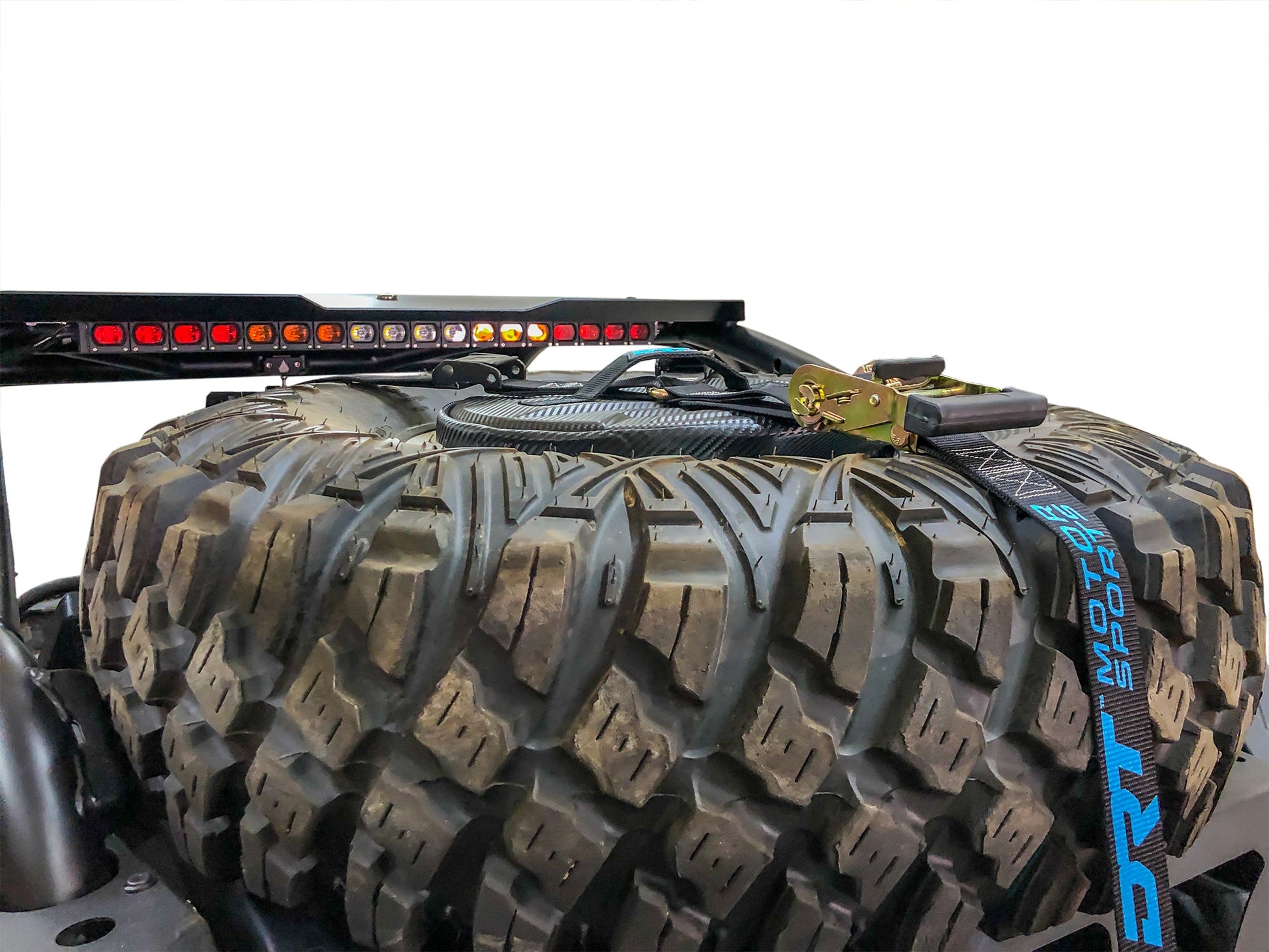 Spare tire storage bag sitting inside inverted off road wheel